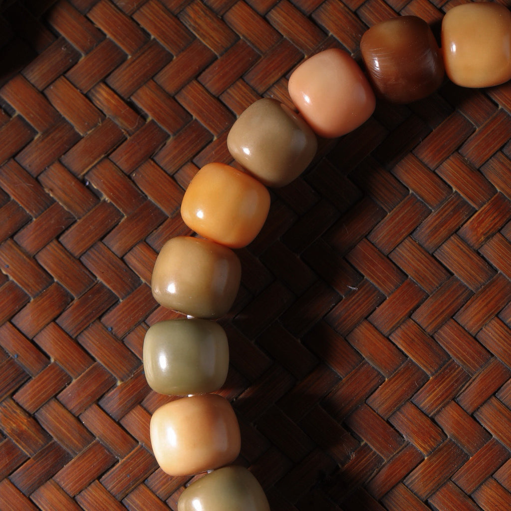 Gradient multicolor Longji Bodhi-style barrel beads in pink, cream, olive and brown tones