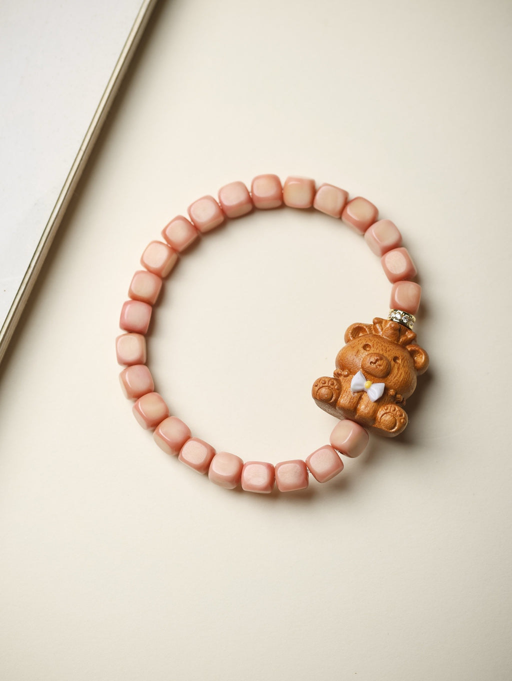 Pink Longji Bodhi candy-cube bracelet with carved sitting-cat style accent