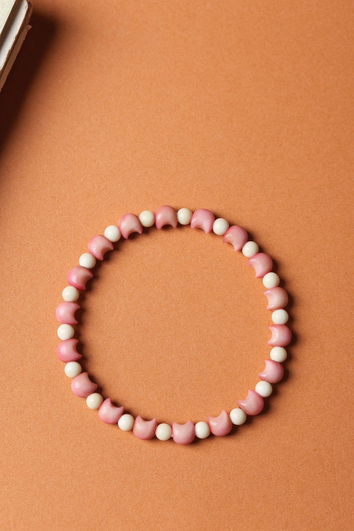Pink Longji Bodhi cat-head shaped beads with ivory-tone round spacers