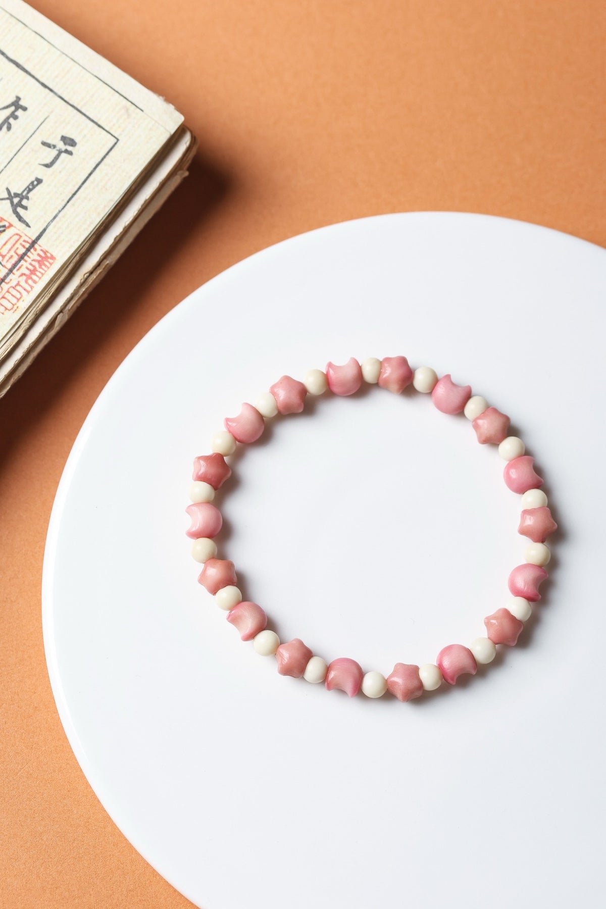 Pink Longji Bodhi star and crescent moon shaped bracelet with ivory-tone spacer beads