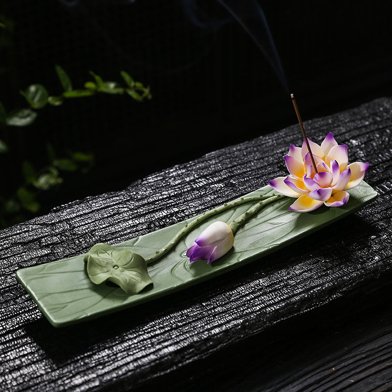 Violet edge lotus ceramic incense stick holder on green leaf tray