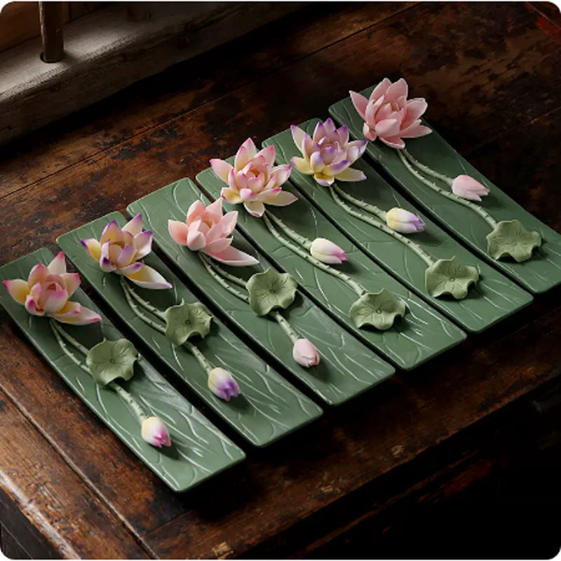 Five ceramic lotus and blossom incense holder styles arranged together