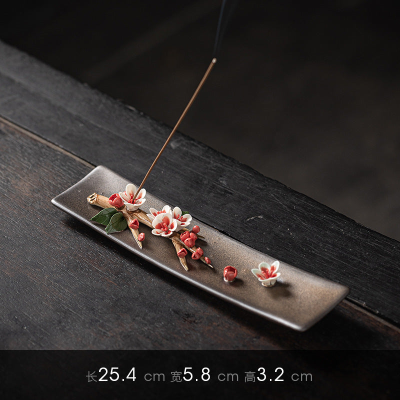 Pink blossom ceramic incense stick tray measuring 25.4 by 5.8 by 3.2 centimeters