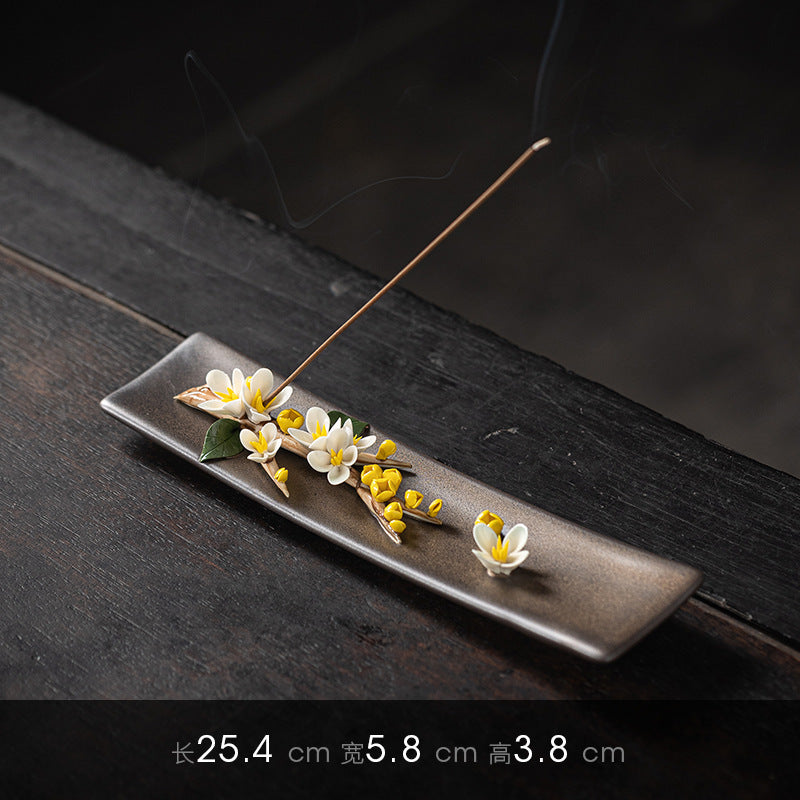 Yellow blossom ceramic incense stick tray measuring 25.4 by 5.8 by 3.8 centimeters