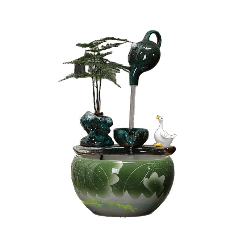 Deep teal ceramic tabletop water fountain with fish bowl
