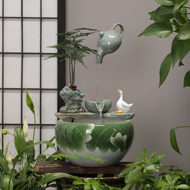 Celadon ceramic flowing water fountain with lotus bowl and bird