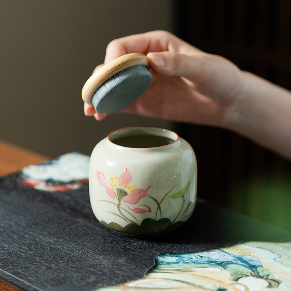 Bamboo lid on hand-painted lotus ceramic tea caddy