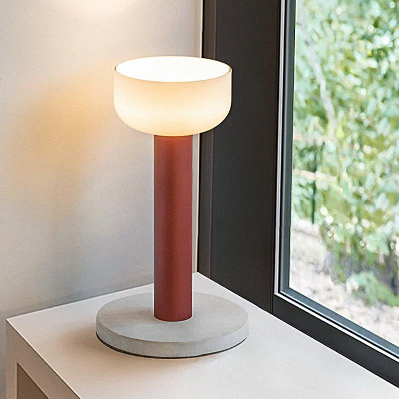 Red and white macaron lamps styled together on side table