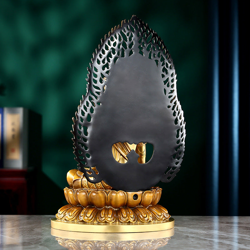 Mahavairocana copper Buddha statue rear view showing sculpted flame halo and lotus base