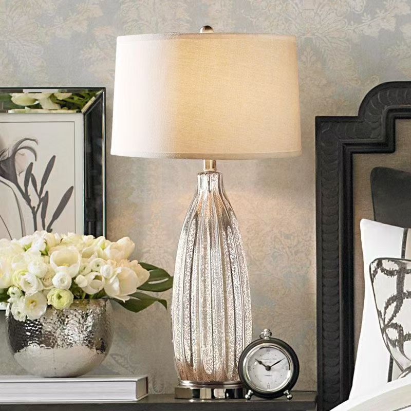 Tall mercury glass table lamp with ivory linen shade