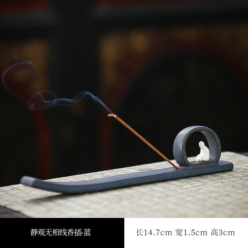Blue-gray Buddha incense stick tray showing 14.7 by 1.5 by 3 cm dimensions