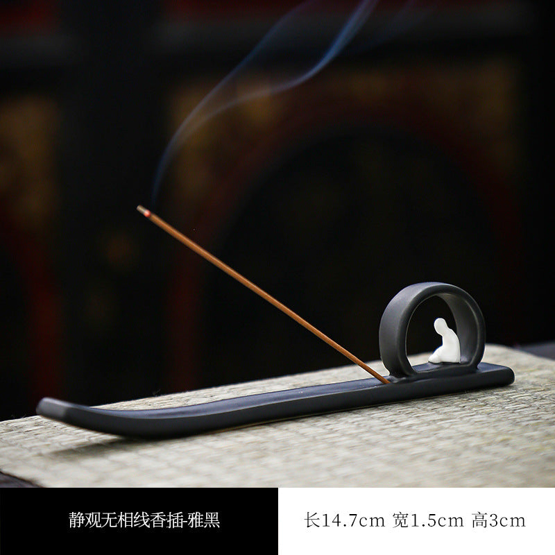 Matte black Buddha incense stick tray showing 14.7 by 1.5 by 3 cm dimensions