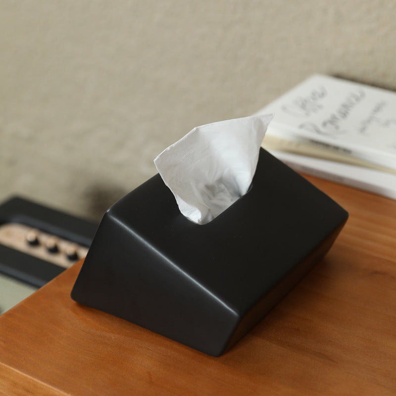 Matte black geometric ceramic tissue box cover in modern interior