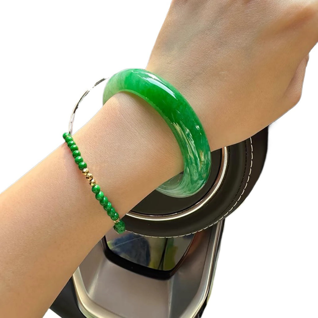 Natural jadeite bangle icy pale base with vivid apple green section
