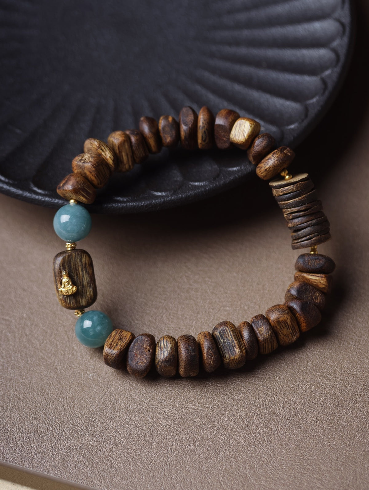 Natural agarwood chunky irregular bead bracelet with blue-green accent beads and small Buddha detail