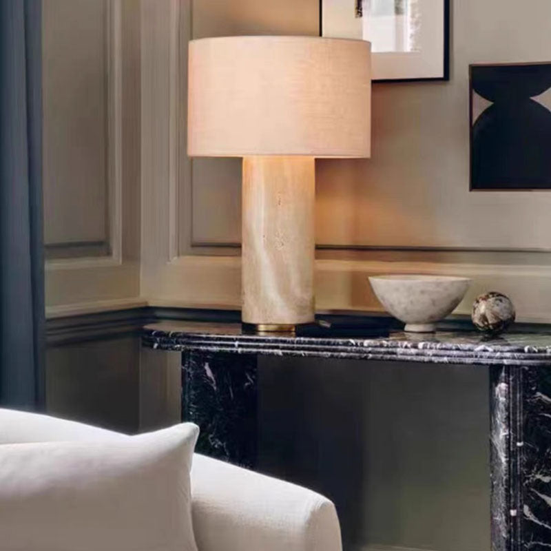 Natural cave stone lamp on a dark marble sideboard