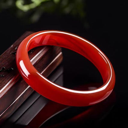 Natural South Red agate bangle on display stand