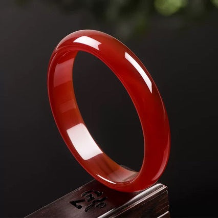 Polished natural red agate bangle side profile