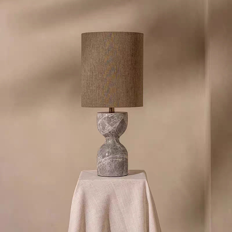 Sculptural natural stone hourglass table lamp with tall fabric shade