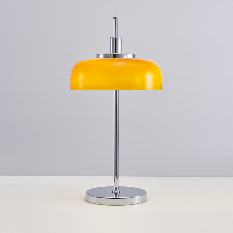 Orange glass dome and chrome table lamp front view