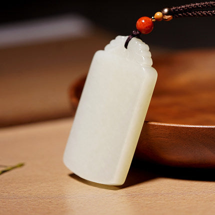 White Hetian jade Wushi Pai peace pendant angled view