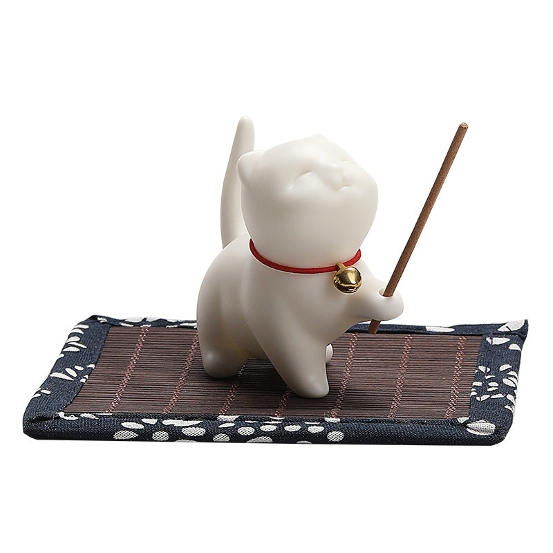 Ivory Palace Cat incense holder cutout view with patterned bamboo mat