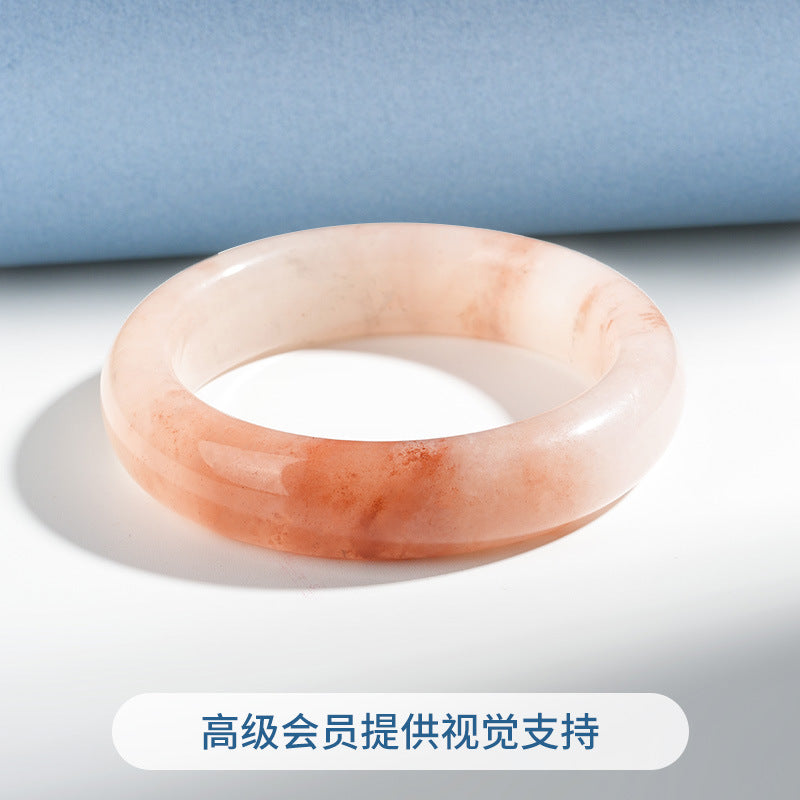 Peach quartzite bangle with warm coral mineral pattern