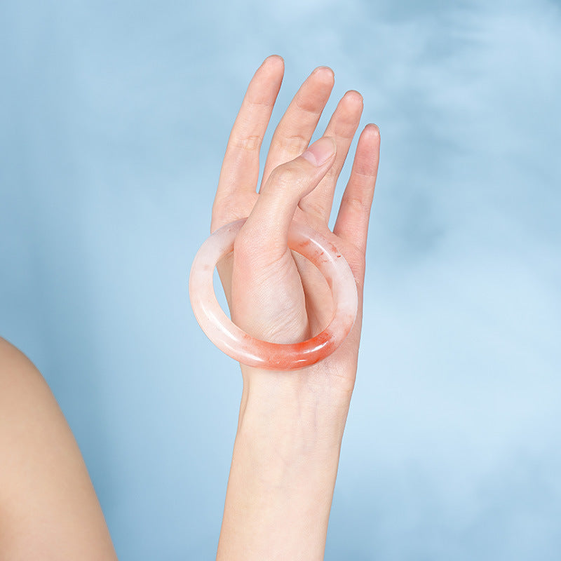 Peach quartzite stone bangle styled on wrist