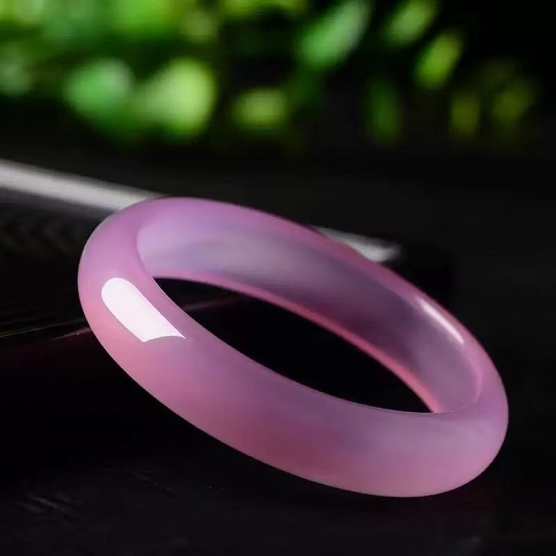 Pink chalcedony stone bangle polished surface detail