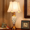 New Chinese porcelain table lamp with magnolia branch pattern and scalloped fabric shade