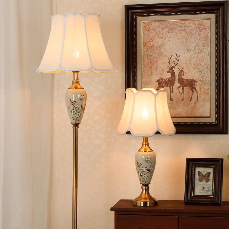 Two New Chinese porcelain table lamps shown together with floral and branch painted bodies