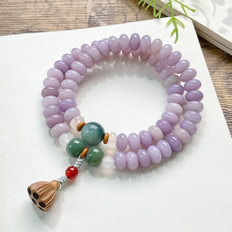 Purple Bodhi root double-wrap bracelet with green accents and carved lotus-pod charm for meditation, gifting and Neo-Chinese styling