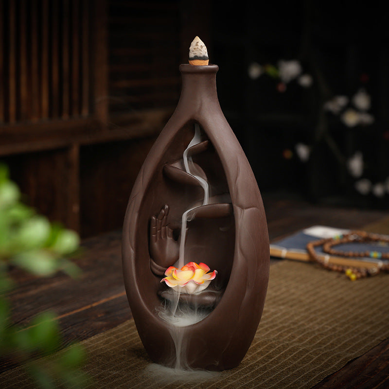 Bottle-shaped purple clay backflow incense burner with Buddha hand lotus and smoke waterfall