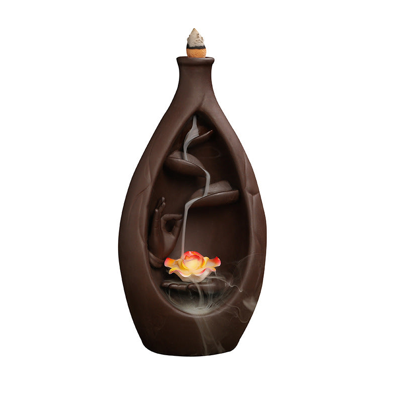 Bottle of Stillness backflow incense burner cutout view with lotus flower