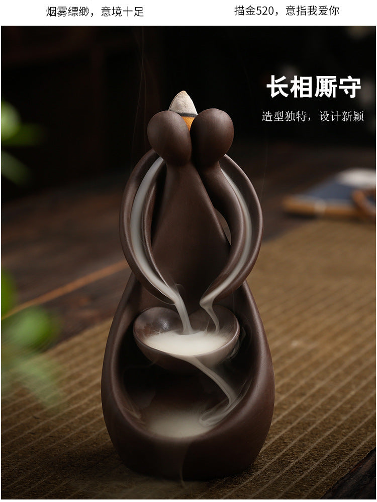 Heart-shaped purple clay backflow incense burner with paired smoke streams and bowl