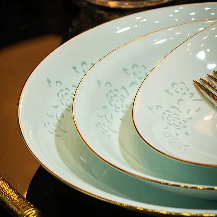 Qingying celadon green porcelain plates with subtle floral pattern and fine gold edging