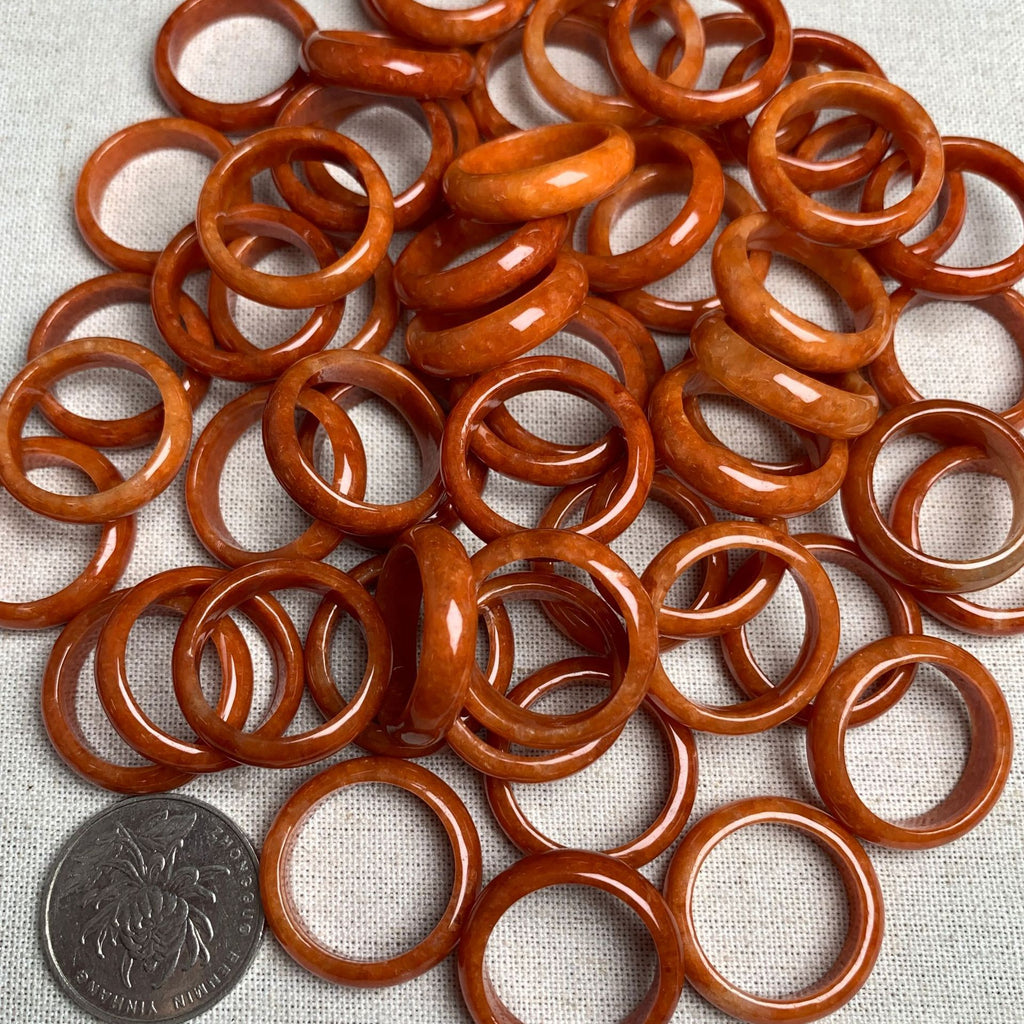 Red orange jadeite band ring assortment with coin for size reference