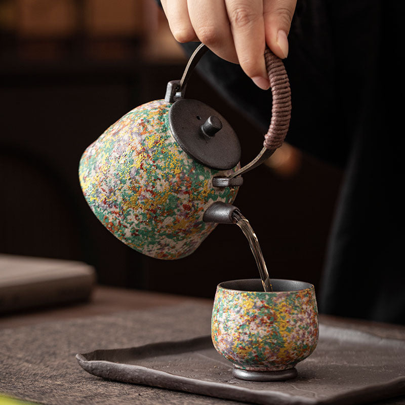 Tea pouring from multicolor rock-painting glaze ceramic Gongfu teapot