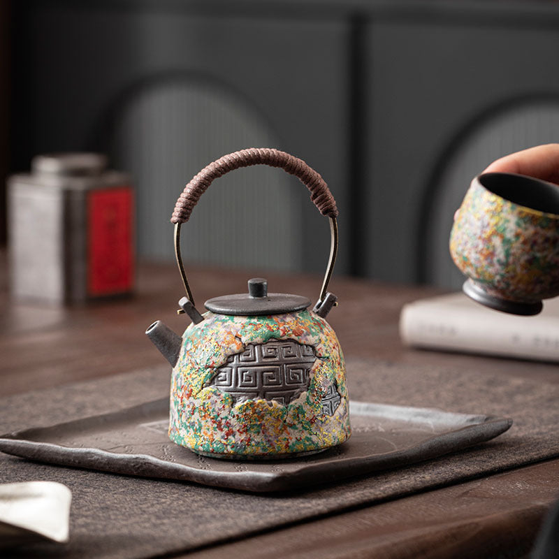 Multicolor rock-painting glaze ceramic teapot styled on a Chinese tea table