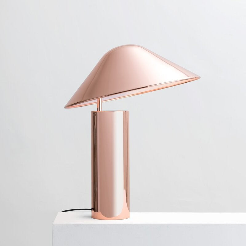 Rose gold cone shade table lamp with cylindrical metallic base