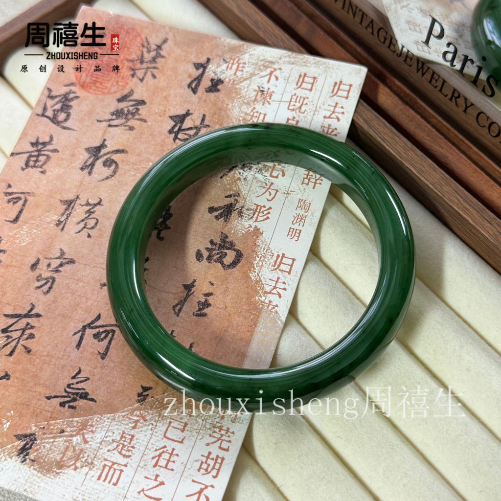 Certified spinach green Hetian jade bangle showing dense nephrite body