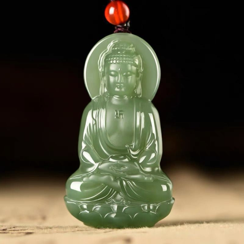 Green carved seated Buddhist figure pendant with halo