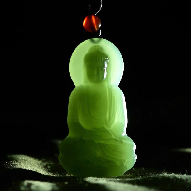 Backlit green Buddhist-inspired pendant showing translucent finish