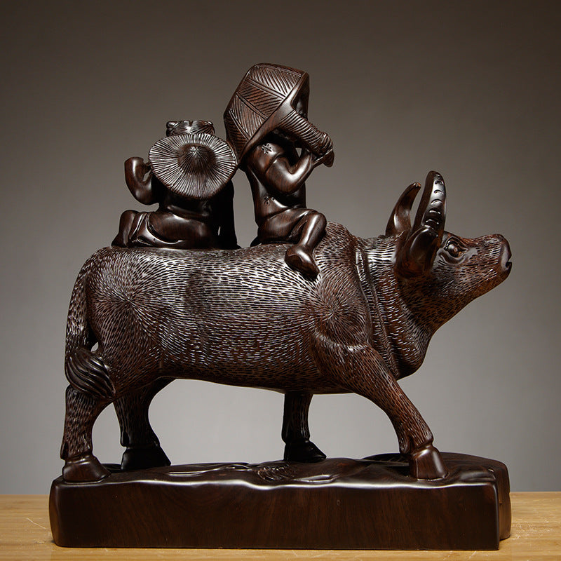 Rear and side view of Chinese shepherd boys riding water buffalo carved sculpture showing pastoral carving detail
