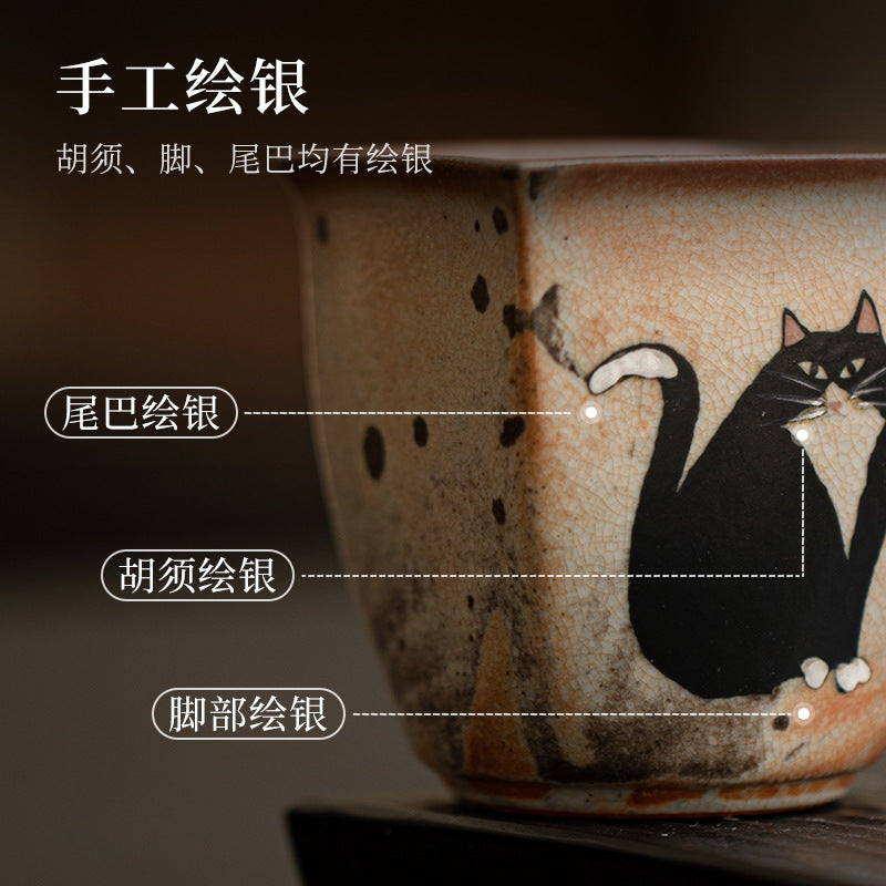 Hand-painted silver-tone whisker paw and tail details on black cat ceramic fairness cup