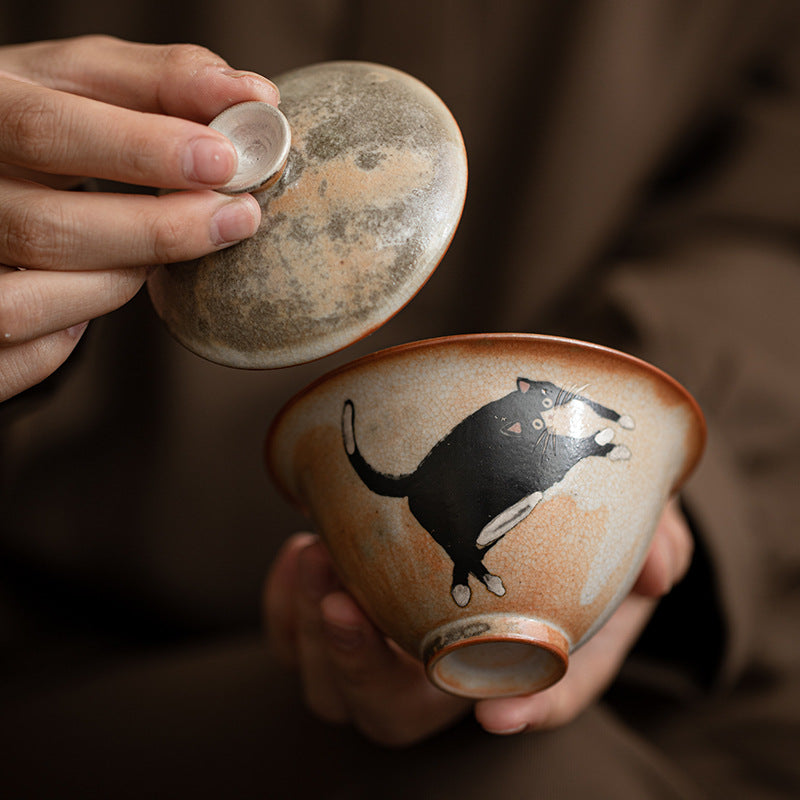 Hand-painted black cat Shino-style ceramic lidded tea bowl with rustic kiln-change glaze
