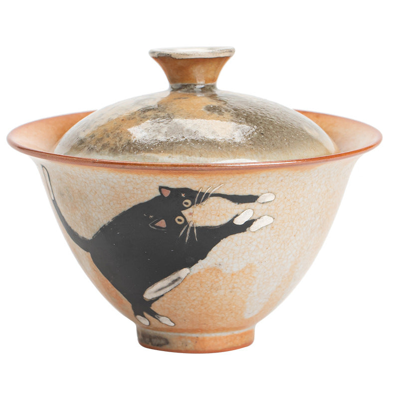 Hand-painted black cat two-piece ceramic lidded tea bowl with Shino-style glaze
