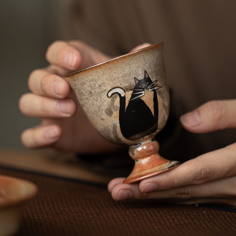 Shino-style ceramic cat tea cup with high-foot design