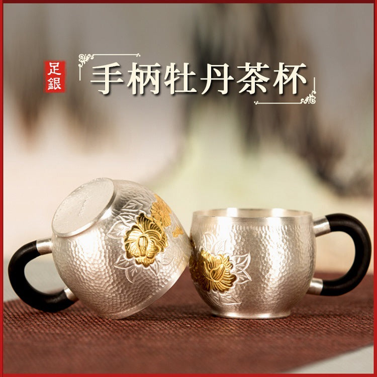 Handcrafted silver tea kettle detail