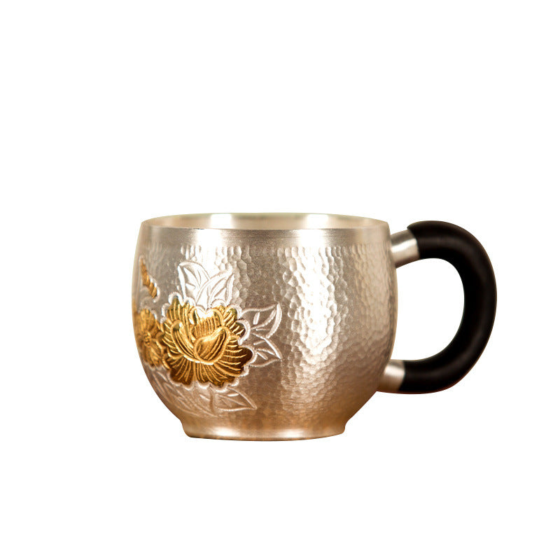 Handmade silver kettle handle and body detail